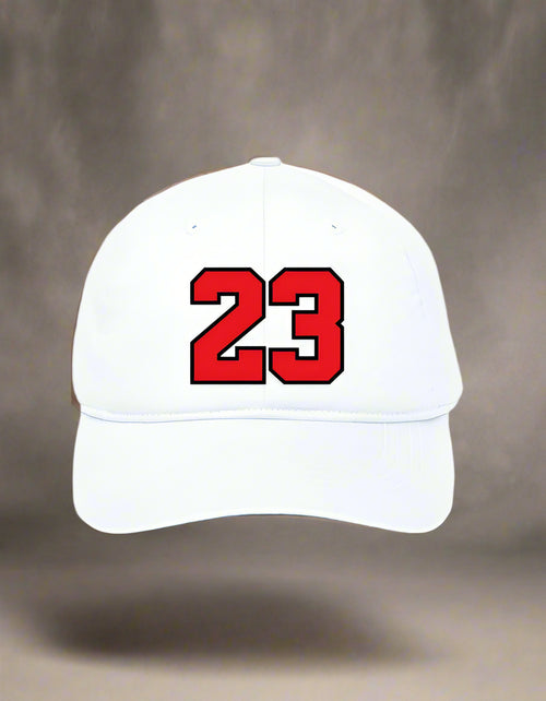 White cap with bold red “23” varsity-style print